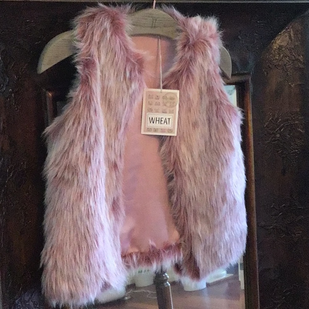 Girl’s fuzzy pink vest